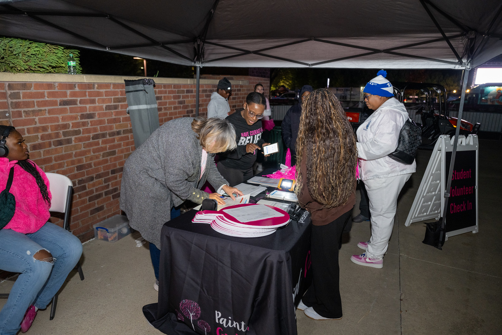 photo of volunteers at signage table
