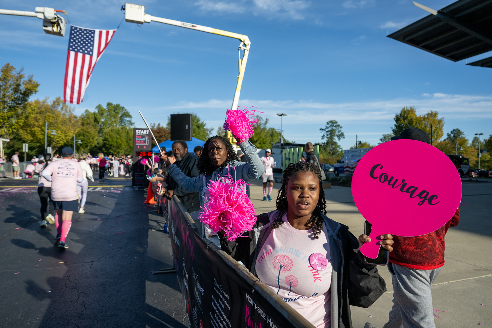 photo of woman holding Courage sign